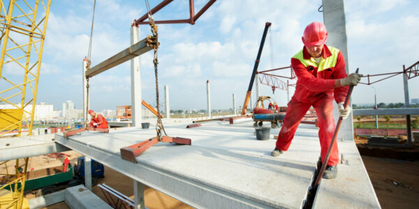 Builder,Worker,In,Safety,Protective,Equipment,Installing,Concrete,Floor,Slab