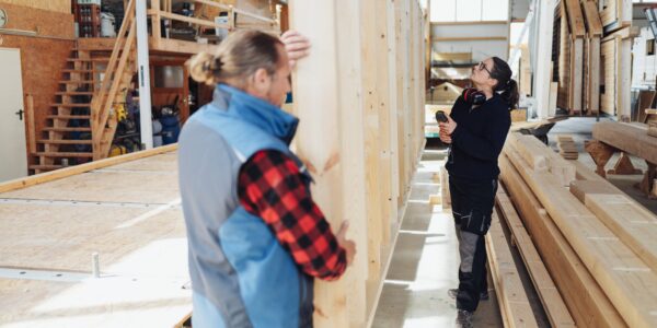 Female,Carpenter,Or,Woodworker,Inspecting,A,Prefabricated,Wall,In,A